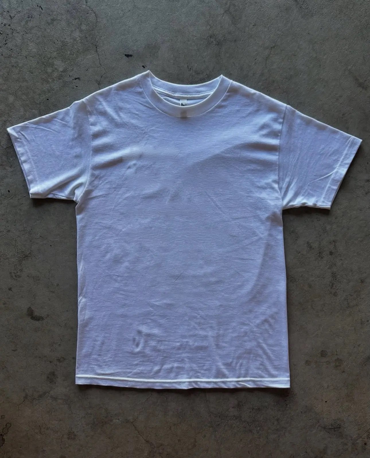 White t-shirt printed with four lines: Paris, New York, London, San Jose